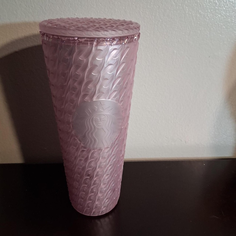 Pink Starbucks tumbler with textured wavy pattern